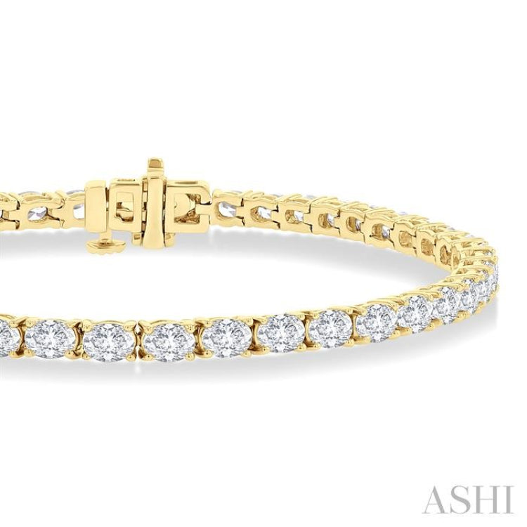 5 1/2 Ctw East West Oval Cut Diamond Fashion Tennis bracelet in 14K Yellow Gold 5 1/2 Ctw East West Oval Cut Diamond Fashion Tennis bracelet in 14K Yellow Gold