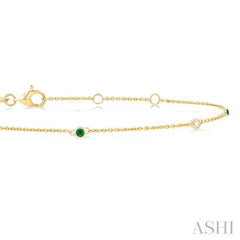 1.75 MM Emerald and 1/20 Ctw Round Cut Diamond Precious Station Bracelet in 14K Yellow Gold 1.75 MM Emerald and 1/20 Ctw Round Cut Diamond Precious Station Bracelet in 14K Yellow Gold
