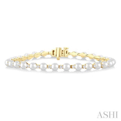 4 MM Cultured Pearl and 3/4 Ctw Round Cut Diamond Tennis Bracelet in 14K Yellow Gold 4 MM Cultured Pearl and 3/4 Ctw Round Cut Diamond Tennis Bracelet in 14K Yellow Gold