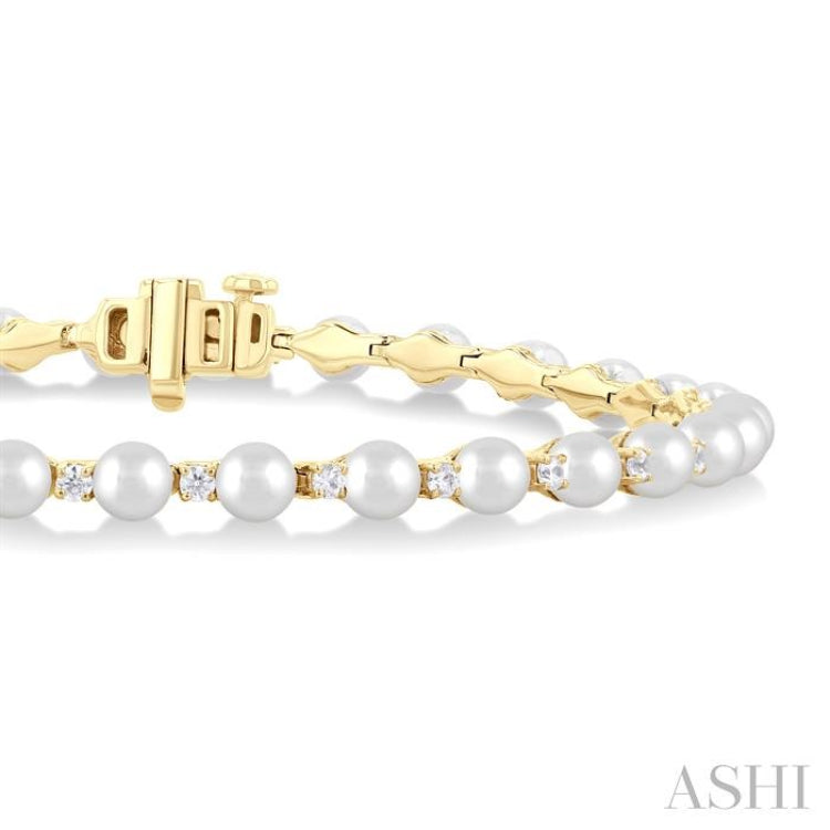 4 MM Cultured Pearl and 3/4 Ctw Round Cut Diamond Tennis Bracelet in 14K Yellow Gold 4 MM Cultured Pearl and 3/4 Ctw Round Cut Diamond Tennis Bracelet in 14K Yellow Gold