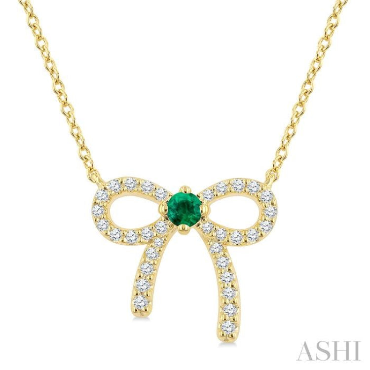 2.40 MM Round Shape Emerald and 1/8 Ctw Bow Round Cut Diamond Fashion Pendant With Chain in 10k Yellow Gold 2.40 MM Round Shape Emerald and 1/8 Ctw Bow Round Cut Diamond Fashion Pendant With Chain in 10k Yellow Gold