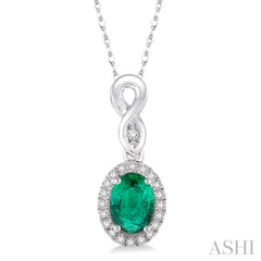 6x4 MM Oval Cut Emerald and 1/10 Ctw Round Cut Diamond Pendant in 14K White Gold with Chain 6x4 MM Oval Cut Emerald and 1/10 Ctw Round Cut Diamond Pendant in 14K White Gold with Chain