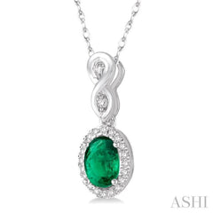 6x4 MM Oval Cut Emerald and 1/10 Ctw Round Cut Diamond Pendant in 14K White Gold with Chain 6x4 MM Oval Cut Emerald and 1/10 Ctw Round Cut Diamond Pendant in 14K White Gold with Chain