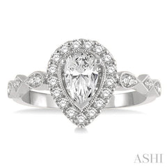 3/4 ctw Carved Shank Round Cut Diamond Engagement Ring With 3/8 ct Pear Cut Center Stone in 14K White Gold 3/4 ctw Carved Shank Round Cut Diamond Engagement Ring With 3/8 ct Pear Cut Center Stone in 14K White Gold