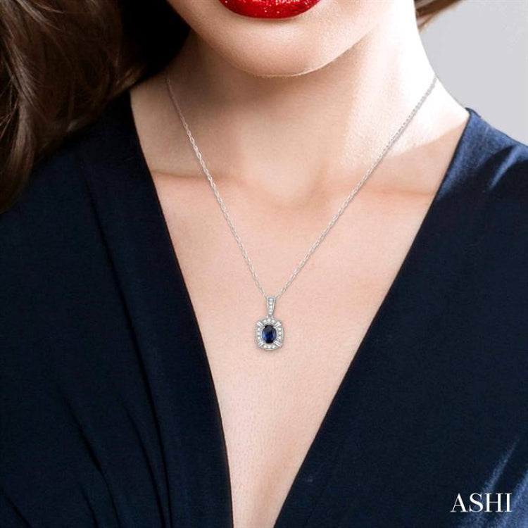 6x4 MM Emerald Shape Sapphire and 1/5 Ctw Round Cut Diamond Pendant in 14K White Gold with Chain 6x4 MM Emerald Shape Sapphire and 1/5 Ctw Round Cut Diamond Pendant in 14K White Gold with Chain