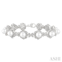6 MM Cultured Pearl and 1/6 Ctw Single Cut Diamond Bracelet in Sterling Silver 6 MM Cultured Pearl and 1/6 Ctw Single Cut Diamond Bracelet in Sterling Silver