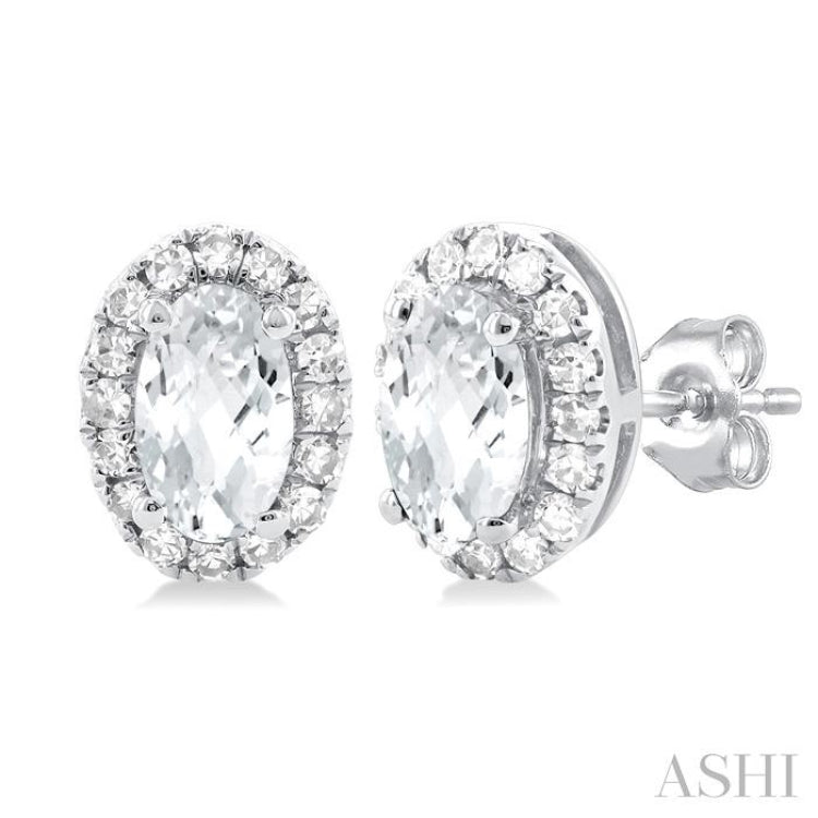 5x3 MM Oval Shape White Topaz and 1/8 Ctw Single Cut Diamond Halo Semi-Precious Stud Earrings in 14K White Gold 5x3 MM Oval Shape White Topaz and 1/8 Ctw Single Cut Diamond Halo Semi-Precious Stud Earrings in 14K White Gold