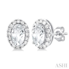 5x3 MM Oval Shape White Topaz and 1/8 Ctw Single Cut Diamond Halo Semi-Precious Stud Earrings in 14K White Gold 5x3 MM Oval Shape White Topaz and 1/8 Ctw Single Cut Diamond Halo Semi-Precious Stud Earrings in 14K White Gold