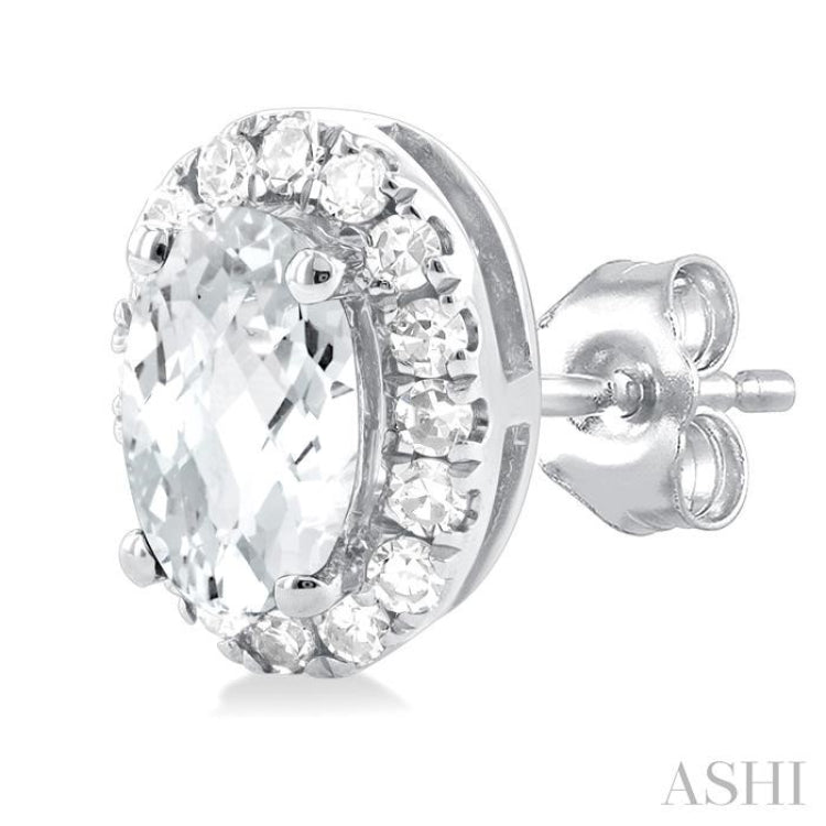 5x3 MM Oval Shape White Topaz and 1/8 Ctw Single Cut Diamond Halo Semi-Precious Stud Earrings in 14K White Gold 5x3 MM Oval Shape White Topaz and 1/8 Ctw Single Cut Diamond Halo Semi-Precious Stud Earrings in 14K White Gold