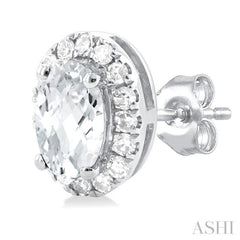 5x3 MM Oval Shape White Topaz and 1/8 Ctw Single Cut Diamond Halo Semi-Precious Stud Earrings in 14K White Gold 5x3 MM Oval Shape White Topaz and 1/8 Ctw Single Cut Diamond Halo Semi-Precious Stud Earrings in 14K White Gold