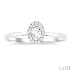 5x3 MM Oval Shape White Topaz and 1/20 Ctw Single Cut Diamond Halo Semi-Precious Ring in 10K White Gold 5x3 MM Oval Shape White Topaz and 1/20 Ctw Single Cut Diamond Halo Semi-Precious Ring in 10K White Gold