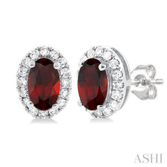 5x3 MM Oval Shape Garnet and 1/8 Ctw Single Cut Diamond Halo Semi-Precious Stud Earrings in 10K White Gold 5x3 MM Oval Shape Garnet and 1/8 Ctw Single Cut Diamond Halo Semi-Precious Stud Earrings in 10K White Gold