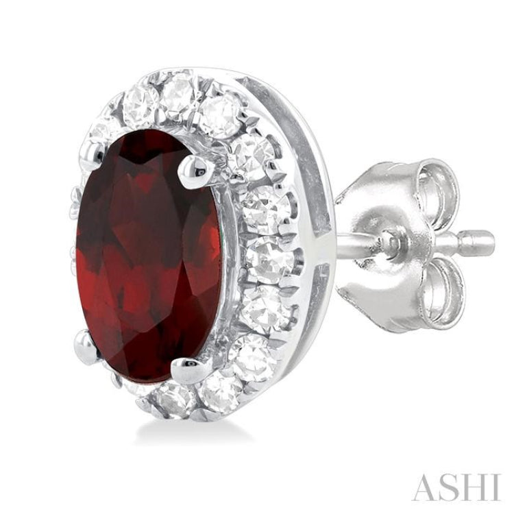 5x3 MM Oval Shape Garnet and 1/8 Ctw Single Cut Diamond Halo Semi-Precious Stud Earrings in 10K White Gold 5x3 MM Oval Shape Garnet and 1/8 Ctw Single Cut Diamond Halo Semi-Precious Stud Earrings in 10K White Gold