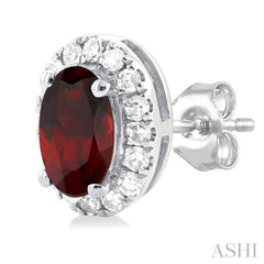 5x3 MM Oval Shape Garnet and 1/8 Ctw Single Cut Diamond Halo Semi-Precious Stud Earrings in 10K White Gold 5x3 MM Oval Shape Garnet and 1/8 Ctw Single Cut Diamond Halo Semi-Precious Stud Earrings in 10K White Gold