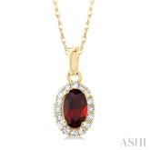 5x3 MM Oval Shape Garnet and 1/20 Ctw Single Cut Diamond Halo Semi-Precious Pendant with Chain in 10K Yellow Gold