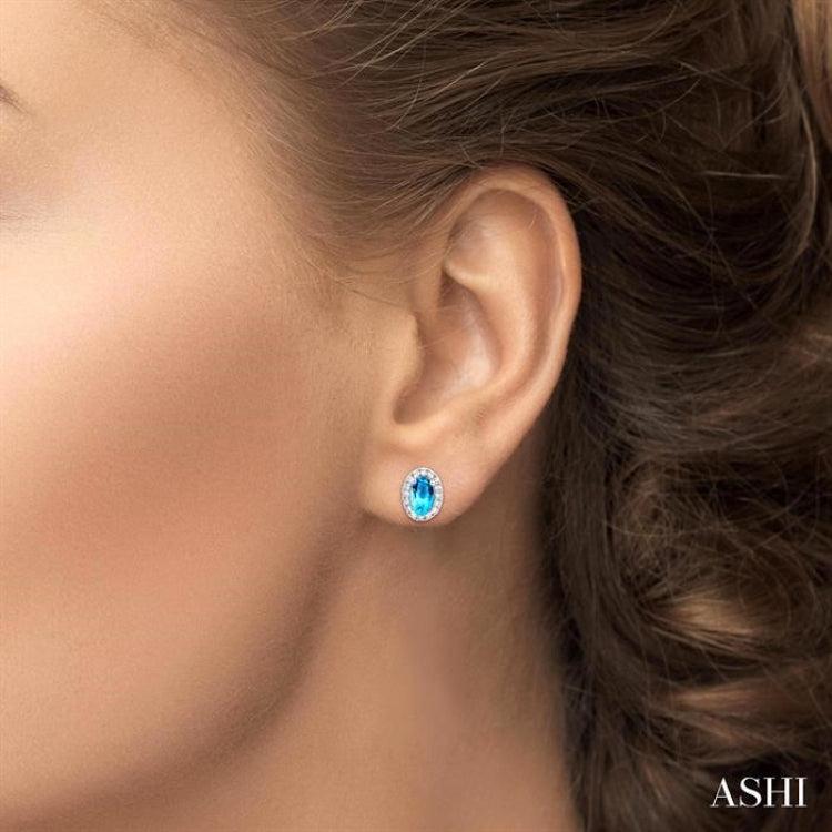 5x3 MM Oval Shape Blue Topaz and 1/8 Ctw Single Cut Diamond Halo Semi-Precious Stud Earrings in 10K White Gold 5x3 MM Oval Shape Blue Topaz and 1/8 Ctw Single Cut Diamond Halo Semi-Precious Stud Earrings in 10K White Gold