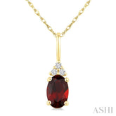 1/50 Ctw Oval Cut 6X4 MM Garnet and Round Cut Diamond Semi-Precious Pendant With Chain in 10K Yellow Gold
