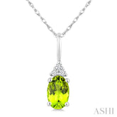 1/50 Ctw Oval Cut 6X4 MM Peridot and Round Cut Diamond Semi-Precious Pendant With Chain in 10K White Gold