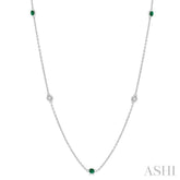 1.75 MM Emerald and 1/6 Ctw Round Cut Diamond Precious Station Necklace in 14K White Gold