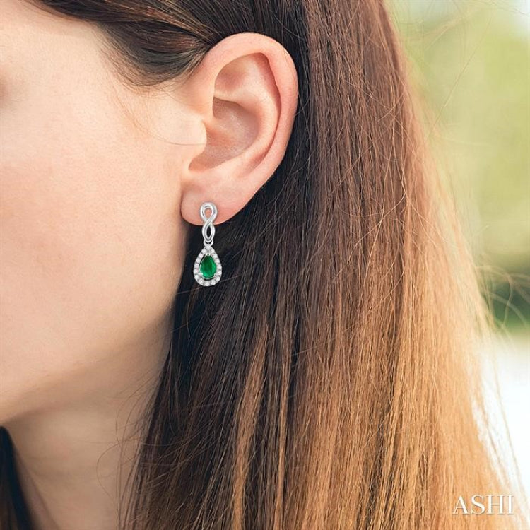 5x3 MM Pear Shape Emerald and 1/6 Ctw Round Cut Diamond Earrings in 10K White Gold 5x3 MM Pear Shape Emerald and 1/6 Ctw Round Cut Diamond Earrings in 10K White Gold