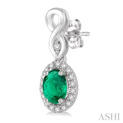 5x3 MM Oval Cut Emerald and 1/6 Ctw Round Cut Diamond Earrings in 10K White Gold 5x3 MM Oval Cut Emerald and 1/6 Ctw Round Cut Diamond Earrings in 10K White Gold