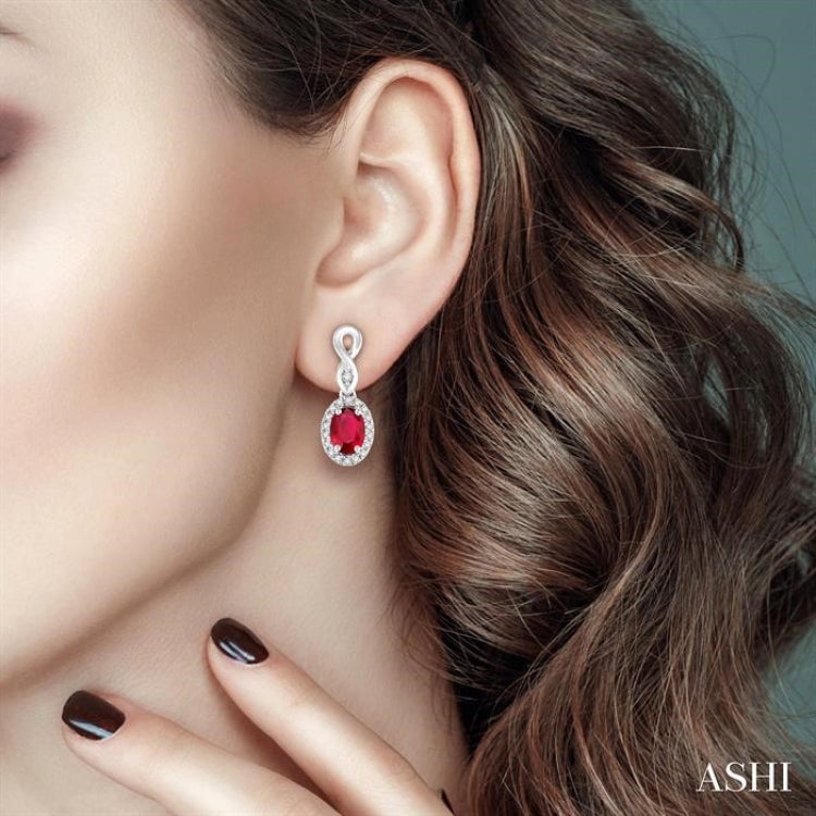 5x3 MM Oval Cut Ruby and 1/6 Ctw Round Cut Diamond Earrings in 14K White Gold 5x3 MM Oval Cut Ruby and 1/6 Ctw Round Cut Diamond Earrings in 14K White Gold
