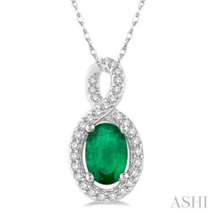 6x4 MM Oval Cut Emerald and 1/10 Ctw Round Cut Diamond Pendant in 10K White Gold with Chain 6x4 MM Oval Cut Emerald and 1/10 Ctw Round Cut Diamond Pendant in 10K White Gold with Chain