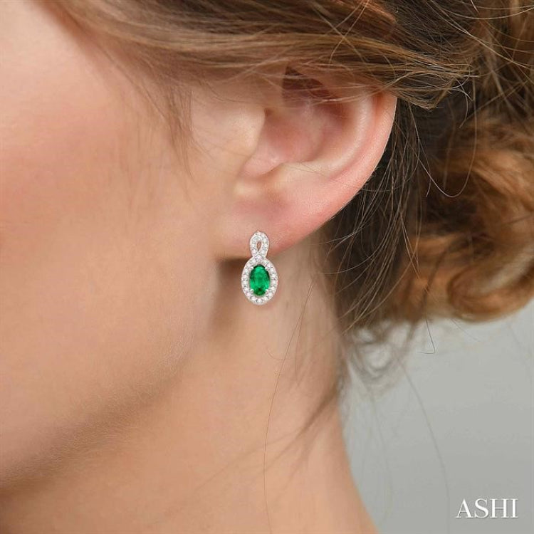 5x3 MM Oval Cut Emerald and 1/5 ctw Round Cut Diamond Earrings in 10K White Gold 5x3 MM Oval Cut Emerald and 1/5 ctw Round Cut Diamond Earrings in 10K White Gold