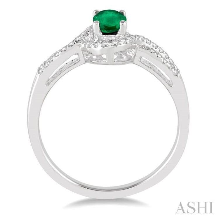 6x4 MM Oval Cut Emerald and 1/6 Ctw Round Cut Diamond Ring in 10K White Gold 6x4 MM Oval Cut Emerald and 1/6 Ctw Round Cut Diamond Ring in 10K White Gold