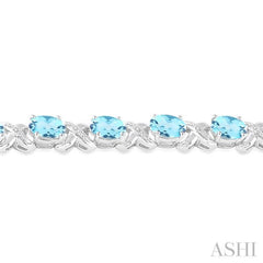 7x5 MM Oval Cut Blue Topaz and 1/20 ctw Round Cut Diamond Fashion Bracelet in Sterling Silver 7x5 MM Oval Cut Blue Topaz and 1/20 ctw Round Cut Diamond Fashion Bracelet in Sterling Silver