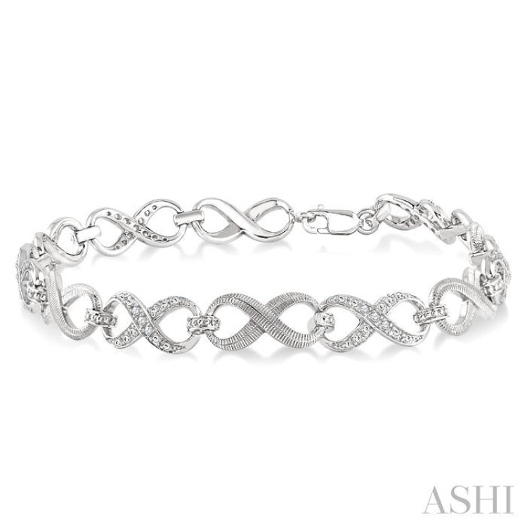 1/10 Ctw Round Cut Diamond Swirl bracelet in Sterling Silver 1/10 Ctw Round Cut Diamond Swirl bracelet in Sterling Silver