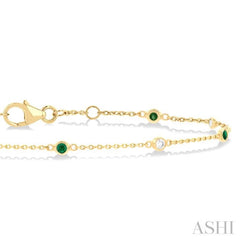 1.8 MM Emerald and 1/10 Ctw Bezel Set Round Cut Diamond Precious Gemstone Station Bracelet in 14K Yellow Gold 1.8 MM Emerald and 1/10 Ctw Bezel Set Round Cut Diamond Precious Gemstone Station Bracelet in 14K Yellow Gold