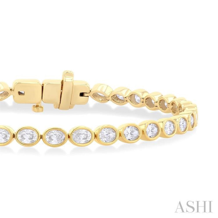 3 3/4 Ctw East-West Bezel Set Oval Cut Diamond Tennis Bracelet in 14K Yellow Gold 3 3/4 Ctw East-West Bezel Set Oval Cut Diamond Tennis Bracelet in 14K Yellow Gold