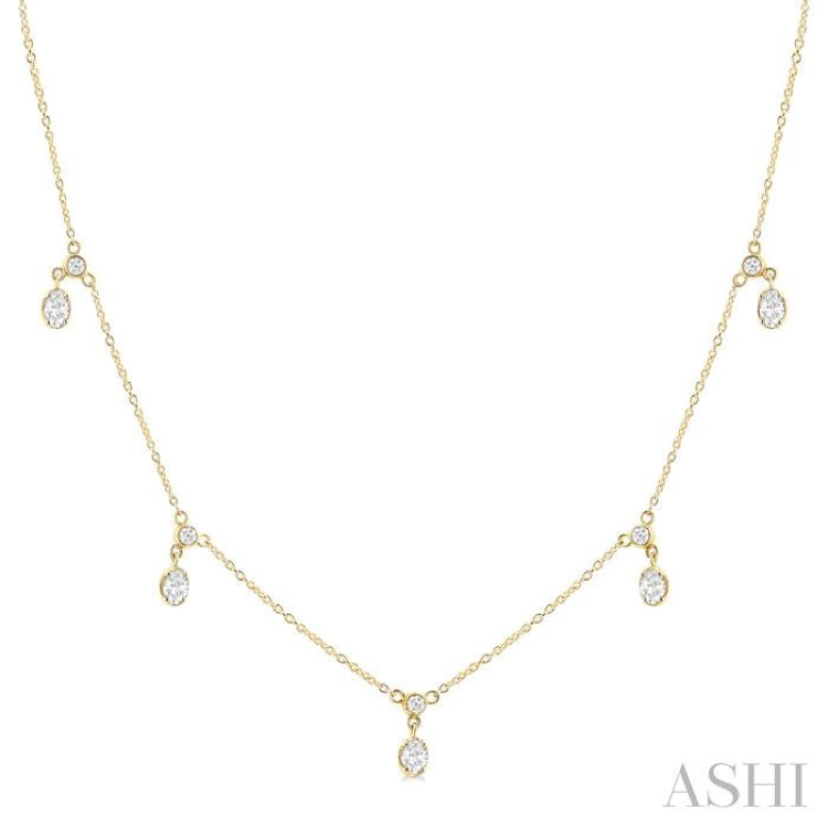 5/8 Ctw Dangle Oval and Round Cut Diamond Station Necklace in 14K Yellow Gold 5/8 Ctw Dangle Oval and Round Cut Diamond Station Necklace in 14K Yellow Gold