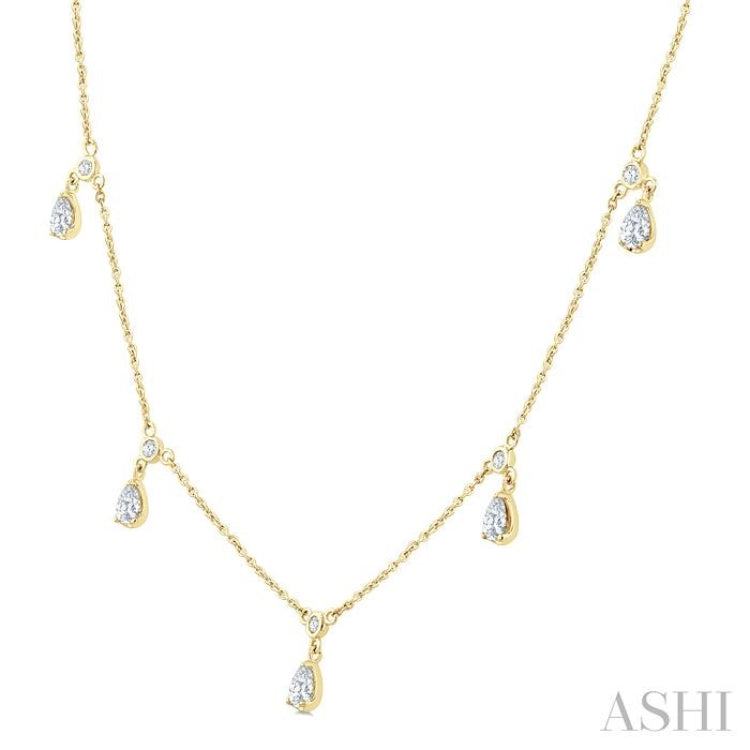 5/8 Ctw Dangle Pear and Round Cut Diamond Station Necklace in 14K Yellow Gold 5/8 Ctw Dangle Pear and Round Cut Diamond Station Necklace in 14K Yellow Gold