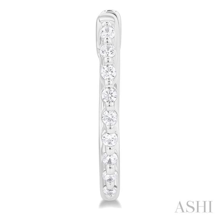 1/6 Ctw Petite Shared Prong Round Cut Diamond Hoop Earring in Sterling Silver 1/6 Ctw Petite Shared Prong Round Cut Diamond Hoop Earring in Sterling Silver