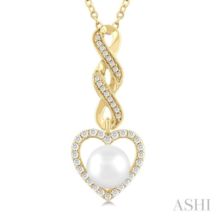 7 MM Round Shape Cultured Pearl and 1/4 Ctw Heart Frame Round Cut Diamond Fashion Pendant With Chain in 10K Yellow Gold 7 MM Round Shape Cultured Pearl and 1/4 Ctw Heart Frame Round Cut Diamond Fashion Pendant With Chain in 10K Yellow Gold