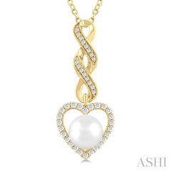 7 MM Round Shape Cultured Pearl and 1/4 Ctw Heart Frame Round Cut Diamond Fashion Pendant With Chain in 10K Yellow Gold 7 MM Round Shape Cultured Pearl and 1/4 Ctw Heart Frame Round Cut Diamond Fashion Pendant With Chain in 10K Yellow Gold