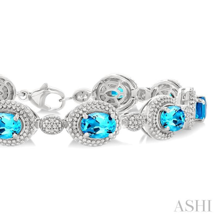 7X5 MM Oval Shape Blue Topaz and 1/10 Ctw Single Cut Diamond Semi-Precious Bracelet in Sterling Silver