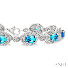 7X5 MM Oval Shape Blue Topaz and 1/10 Ctw Single Cut Diamond Semi-Precious Bracelet in Sterling Silver