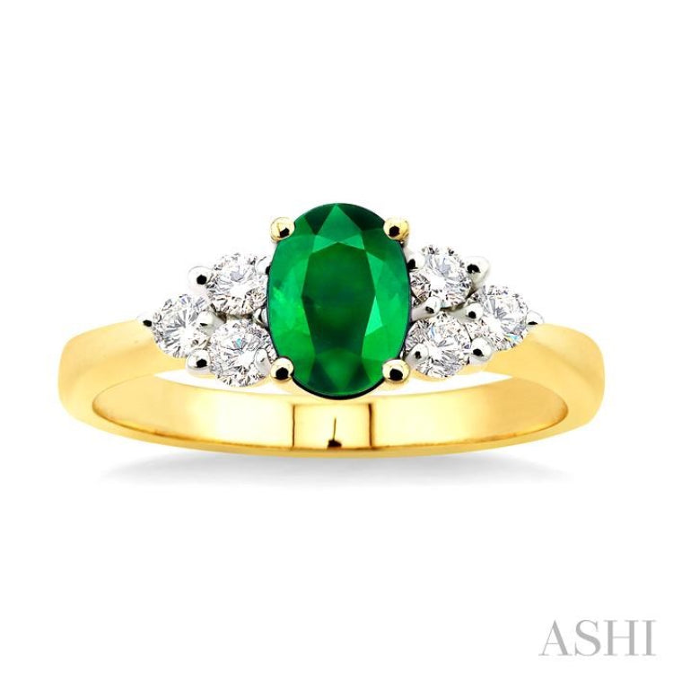 7x5mm Oval Cut Emerald and 1/3 Ctw Round Cut Diamond Ring in 14K Yellow Gold