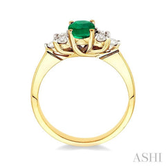 7x5mm Oval Cut Emerald and 1/3 Ctw Round Cut Diamond Ring in 14K Yellow Gold