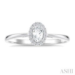 5x3 MM Oval Shape White Topaz and 1/20 Ctw Round Cut Diamond Halo Semi-Precious Ring in 10K White Gold
