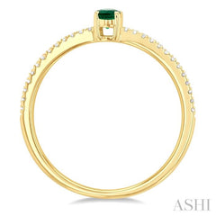 5x3 MM Oval Cut Emerald and 1/10 Ctw Petite Round Cut Diamond Precious Fashion Ring in 10K Yellow Gold