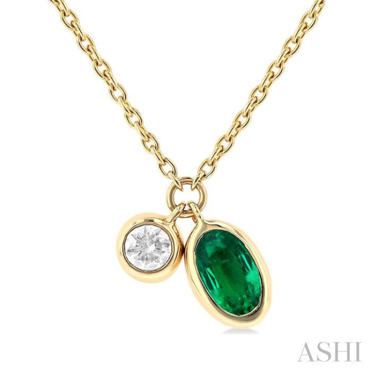 5x3 MM Oval Cut Emerald and 1/50 Ctw Bezel Set Round Cut Diamond Precious Pendant With Chain in 10K Yellow Gold