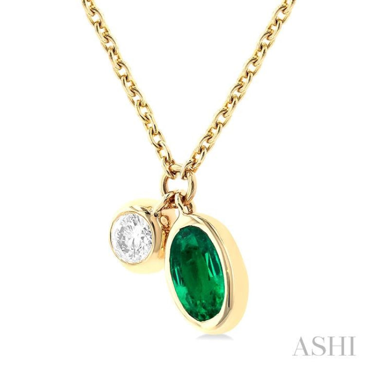 5x3 MM Oval Cut Emerald and 1/50 Ctw Bezel Set Round Cut Diamond Precious Pendant With Chain in 10K Yellow Gold