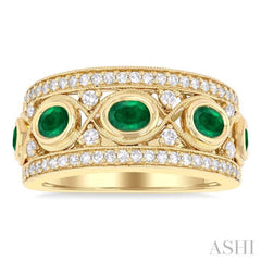 4x3 MM Oval and 2.8 MM Round Cut Emerald and 3/8 Ctw Curvy Criss-Cross Single Cut Diamond Precious Band in 14K Yellow Gold